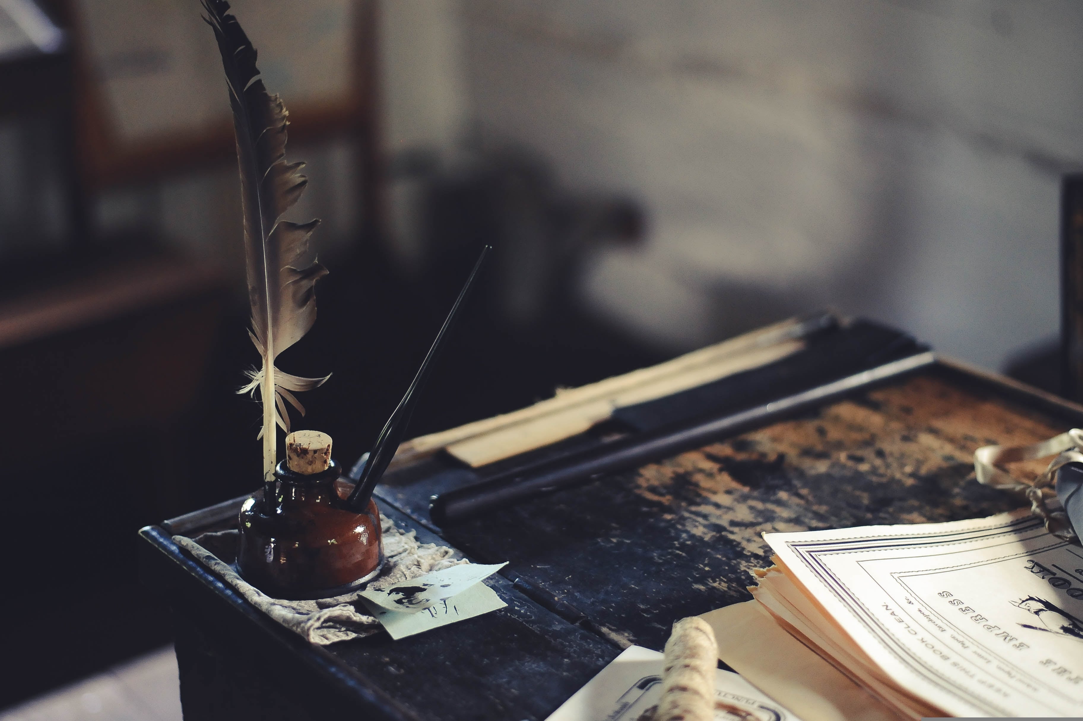 manuscript writing with feather